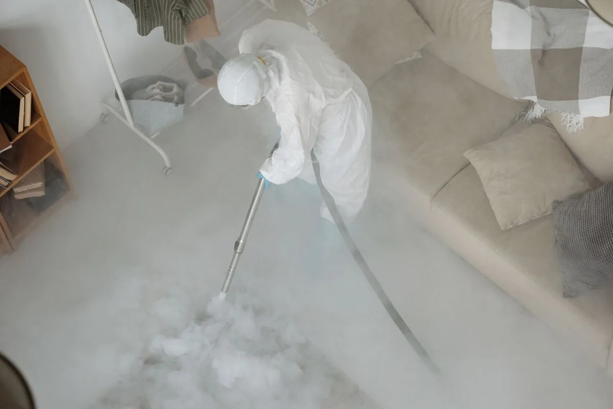 Biohazard cleanup technician in protective equipment, Vinco, PA